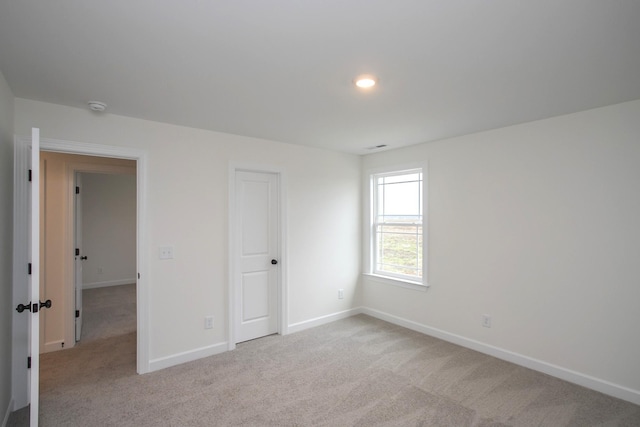 view of carpeted spare room