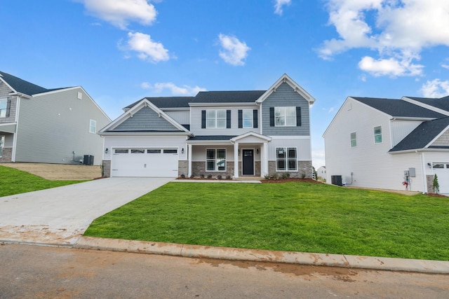 view of front of home featuring covered porch, a front yard, and central AC