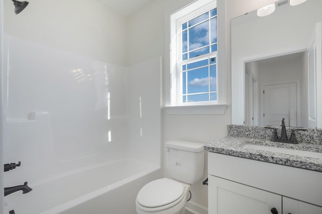 full bathroom with vanity, toilet, and washtub / shower combination