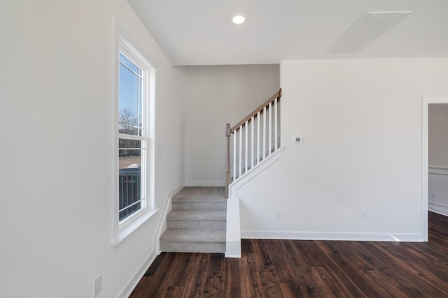 stairs with wood-type flooring