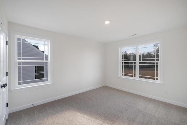 spare room featuring carpet flooring