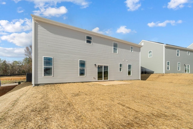 back of property featuring central air condition unit