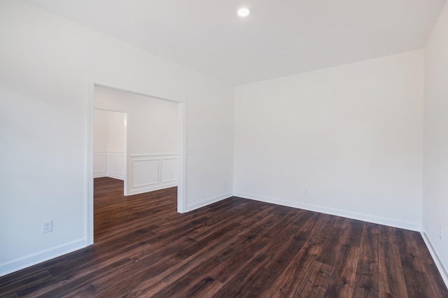 unfurnished room featuring dark hardwood / wood-style floors