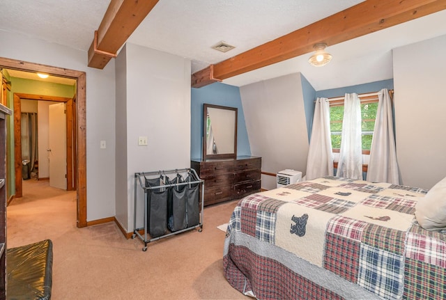 carpeted bedroom featuring beam ceiling