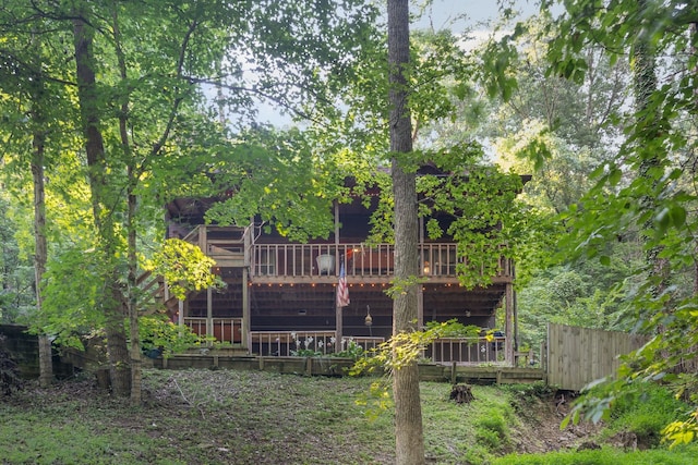 rear view of property with a wooden deck