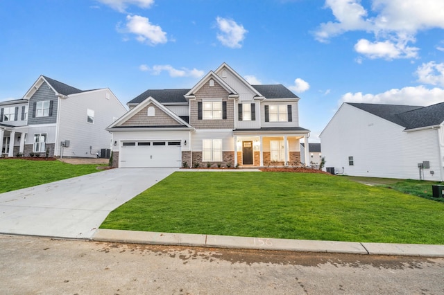 view of front of home with central AC, a garage, and a front lawn