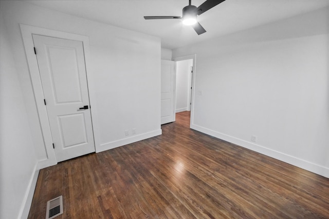 unfurnished bedroom with dark hardwood / wood-style floors and ceiling fan