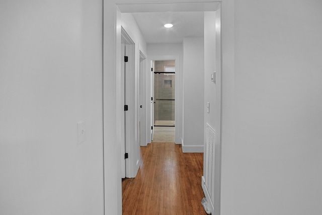 hallway featuring light hardwood / wood-style flooring