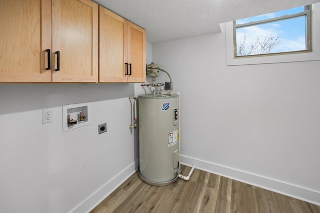 laundry room with washer hookup, cabinets, hookup for an electric dryer, electric water heater, and hardwood / wood-style flooring