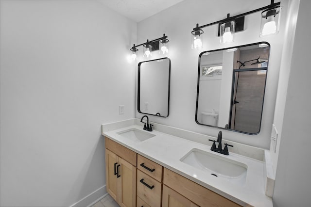 bathroom featuring tile patterned floors, walk in shower, vanity, and toilet