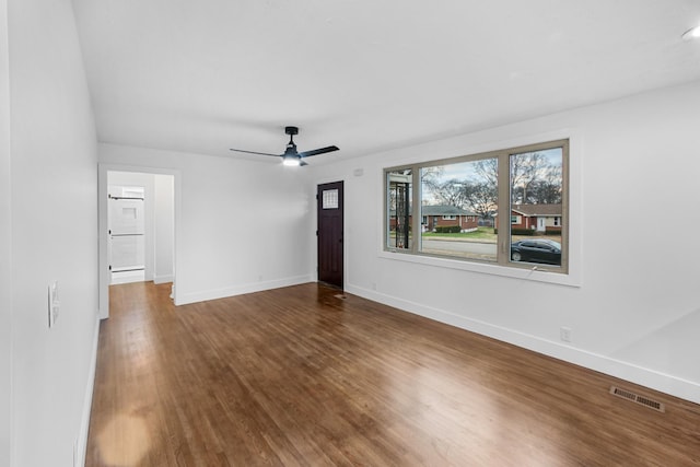 spare room featuring ceiling fan and wood-type flooring