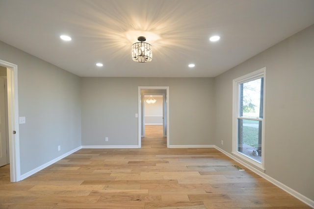 unfurnished room with light hardwood / wood-style flooring