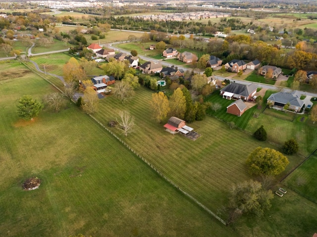 birds eye view of property with a rural view