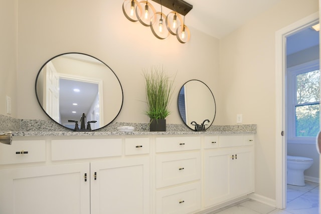 bathroom with vanity and toilet