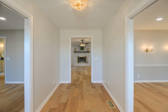 hallway with light wood-type flooring