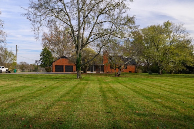 view of yard with a garage