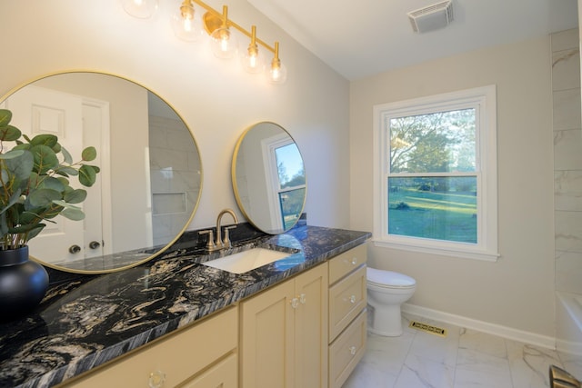 bathroom with vanity and toilet