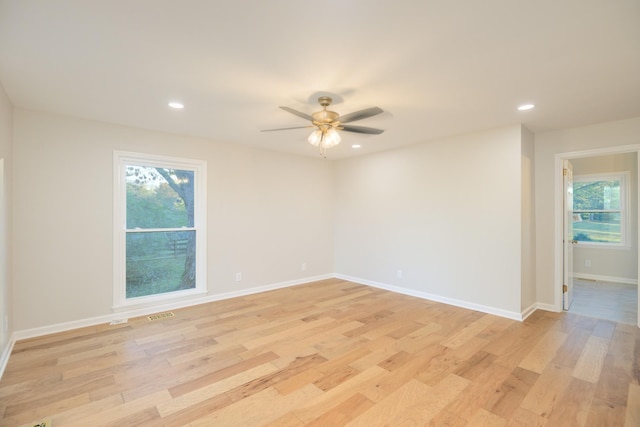 spare room with ceiling fan and light hardwood / wood-style flooring