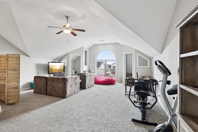 workout room with carpet flooring, ceiling fan, and lofted ceiling