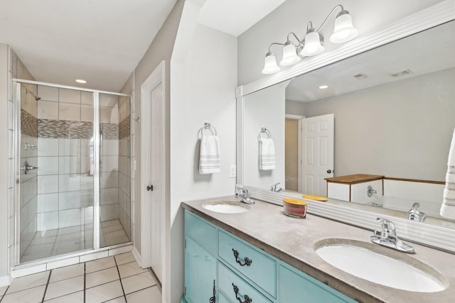 bathroom featuring vanity, tile patterned floors, and a shower with shower door