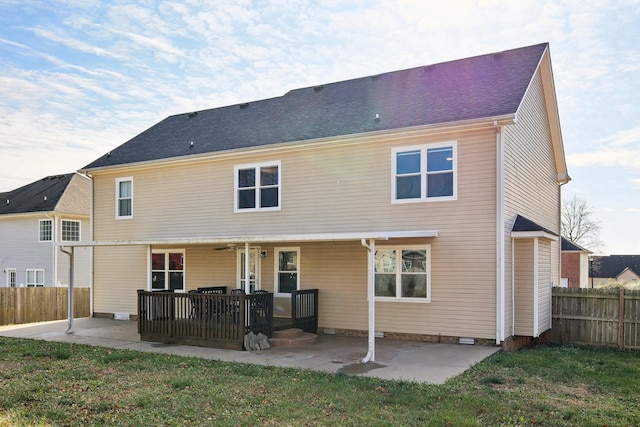 rear view of property featuring a lawn, a patio area, ceiling fan, and a porch