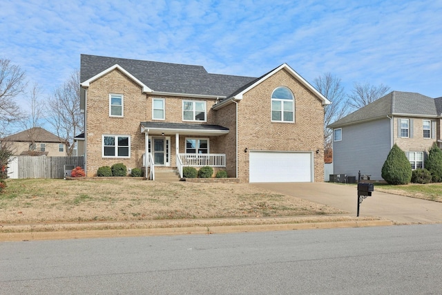 view of front property with covered porch and a garage