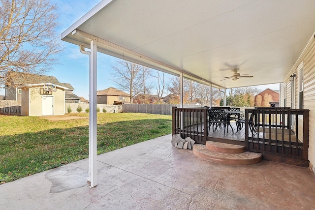 view of patio / terrace featuring ceiling fan and a storage unit