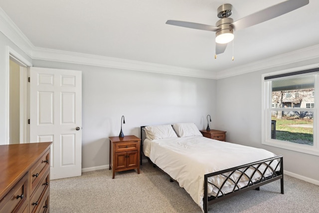 carpeted bedroom with ceiling fan and crown molding