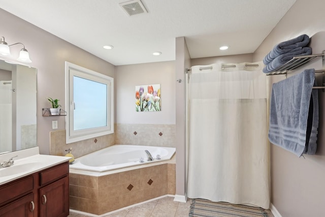 bathroom with tile patterned floors, vanity, and independent shower and bath