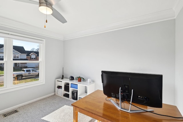 carpeted home office with plenty of natural light, ceiling fan, and crown molding