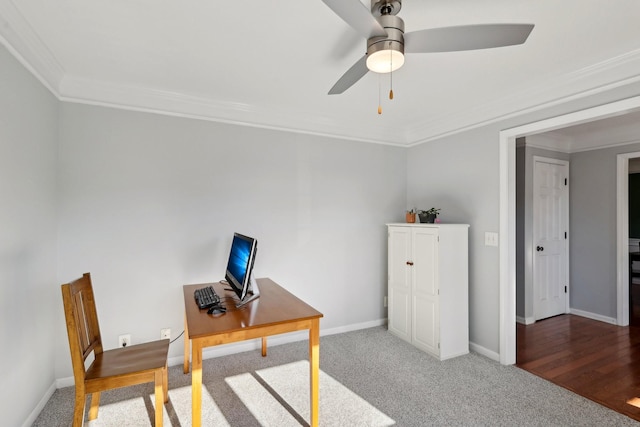 office featuring ceiling fan, carpet floors, and ornamental molding