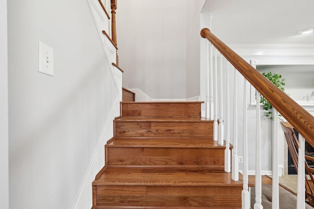 stairs featuring ornamental molding