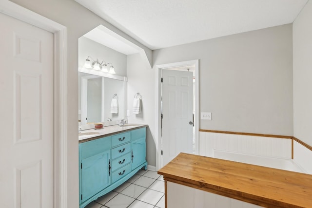 bathroom featuring tile patterned flooring and vanity