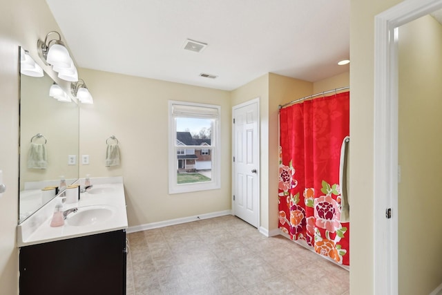 bathroom featuring a shower with shower curtain and vanity