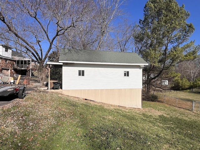 view of side of home featuring a lawn