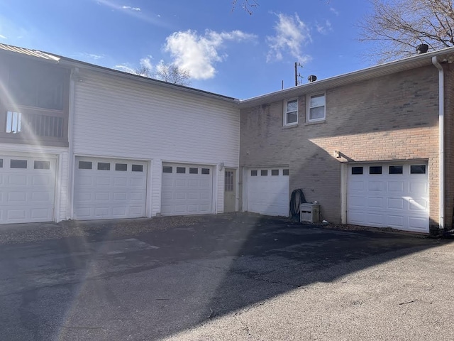 view of side of home with a garage