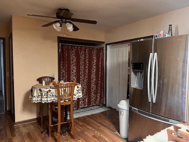 kitchen with ceiling fan, dark wood-type flooring, and stainless steel refrigerator with ice dispenser