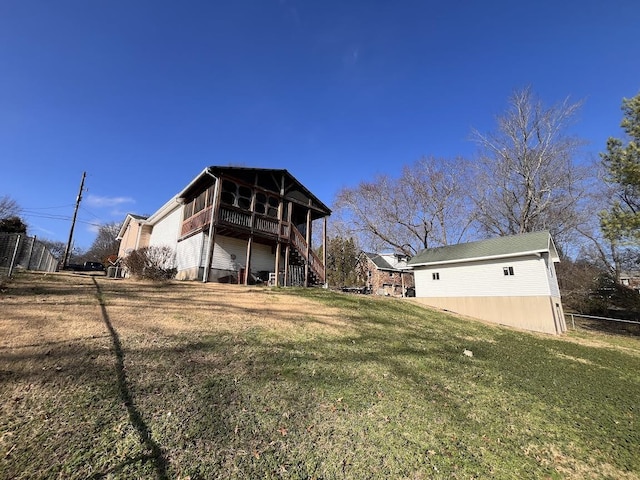 rear view of property with a yard