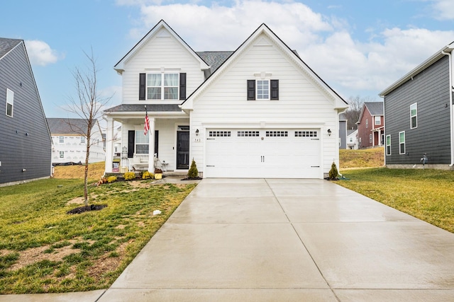 view of front of home with a garage, a front lawn, and a porch