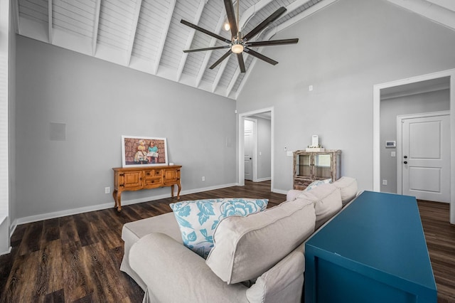 living room with ceiling fan, dark hardwood / wood-style flooring, high vaulted ceiling, beamed ceiling, and wood ceiling