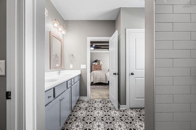 bathroom featuring tile patterned flooring and vanity