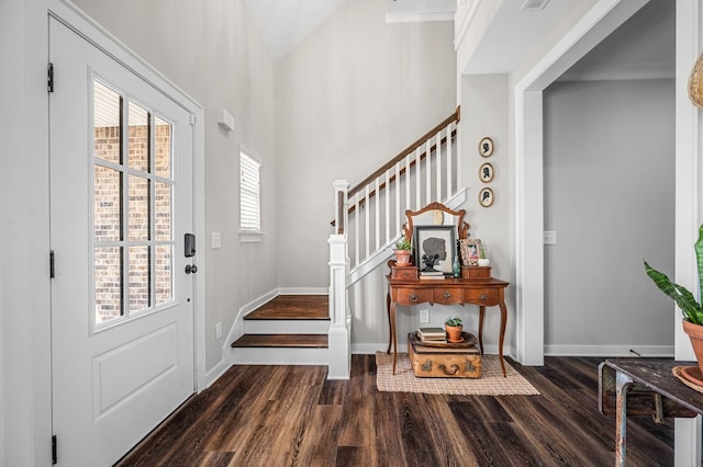 entryway with dark hardwood / wood-style flooring