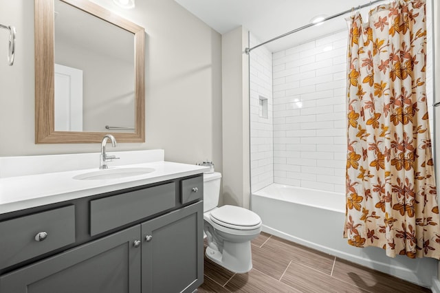 full bathroom featuring vanity, shower / bath combination with curtain, and toilet