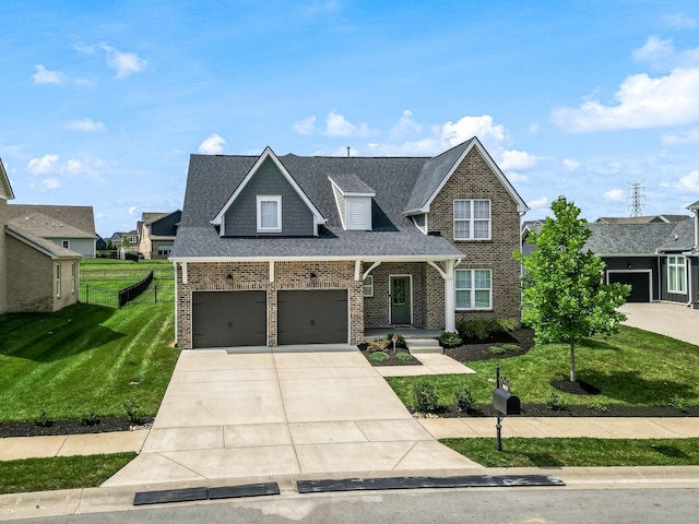 view of front of property featuring a garage and a front yard