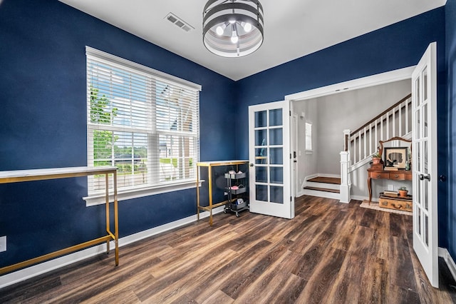 interior space with french doors and dark hardwood / wood-style floors