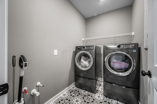 laundry area featuring washing machine and dryer