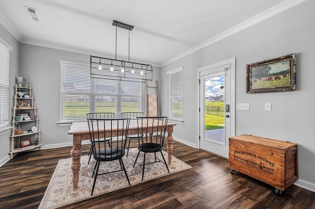 dining room featuring dark hardwood / wood-style flooring and ornamental molding