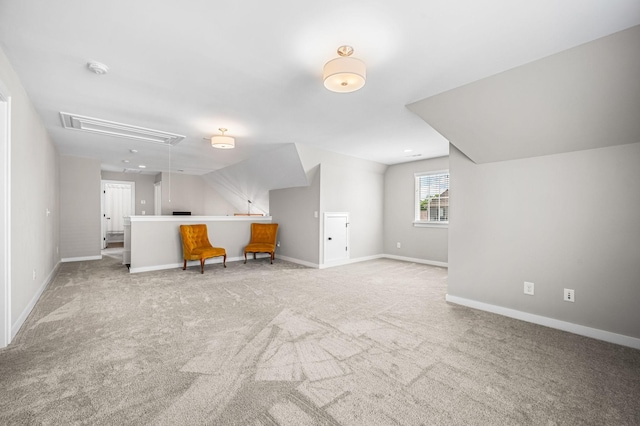 bonus room featuring light colored carpet and lofted ceiling