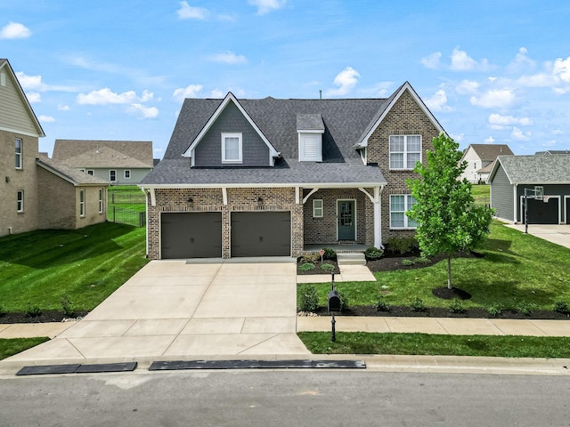 view of front of house featuring a front lawn and a garage