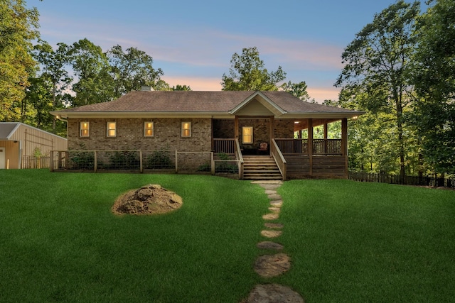 view of front of home featuring a lawn